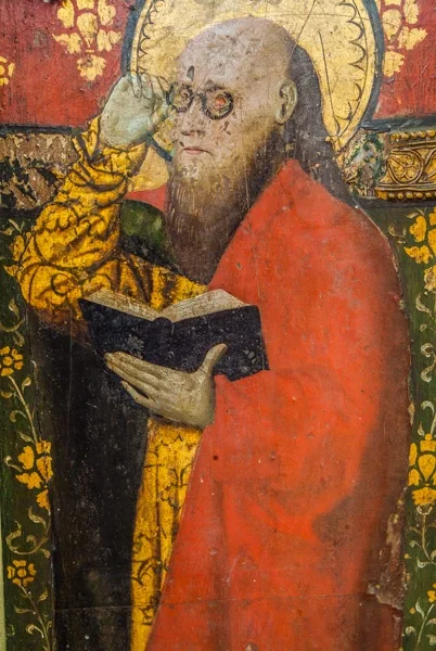St Matthew with his spectacles on the 15th century screen