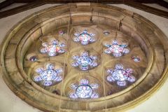 The ornate rose window in the west wall
