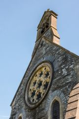 The rose window and bell-cote