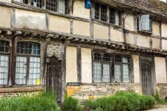 Tudor timber-framed cottages opposite the church