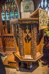 The richly carved oak pulpit