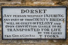 An intriguing sign on the 19th century bridge beside the churchyard