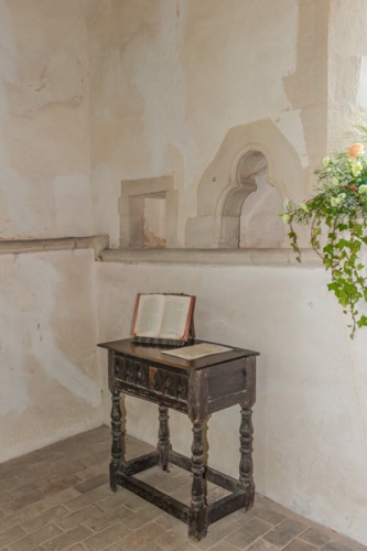13th-c. piscina and 17th-c. communion table