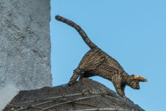 An amusing thatched cat figure