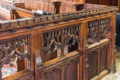 The beautifully traceried pews