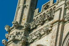 Carved heads on the tower frieze