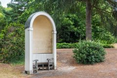 Sheltered Gothic seats line the lakeshore