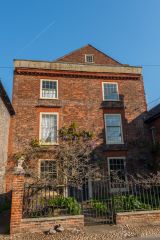 A picturesque red brick cottage