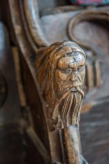 Carved head on the medieval choir stalls