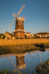 The windmill reflected in the River Glaven