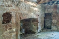 The ground-floor fireplace and spice cupboard
