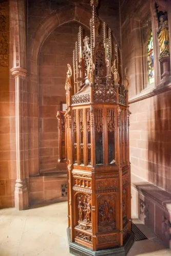 The octagonal font and cedar casing