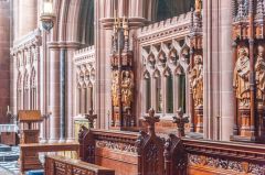 The richly-decorated chancel and choir stalls