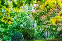 A glimpse of Cluny House from the garden trail