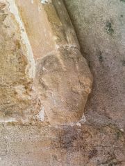 Medieval carved head (a dog?) south doorway