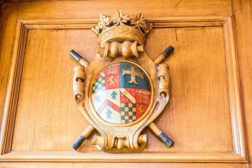 A carved coat of arms, Earl Marshal's Court