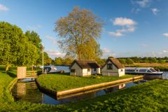 Boathouses on the River Bure at Coltishall Staithe