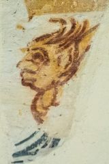 Wall painting of a face on the south nave wall