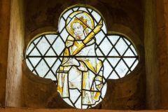 A medieval stained glass window in the church