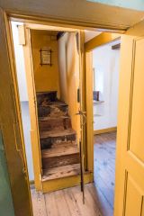 The first floor landing and attic stairs