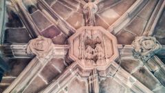 Roof bosses under the vaulted entrance gateay