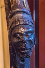 Carved head on the ground floor staircase