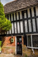 A timber-framed house near the churchyard