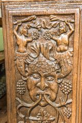 Crowcombe Church of the Holy Ghost, Bench end depicting a Green Man figure