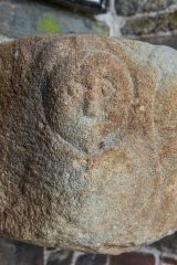 Another of the carved heads on the stoup