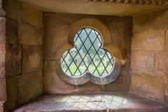 A trefoil window in the south porch