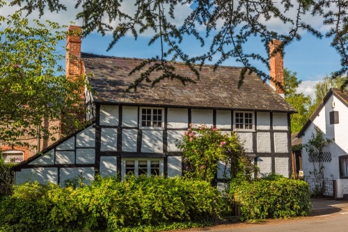 A timber-framed cottage opposite the village green