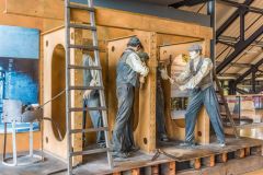 The Shipbuilders exhibition showing riveters at work