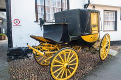 An ancient carriage outside the George Hotel