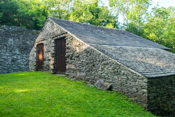 A stone building above the furnace stack