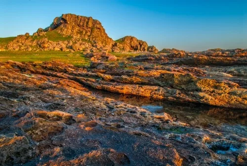 Dunagoil Hill Fort from the volcanic foreshore
