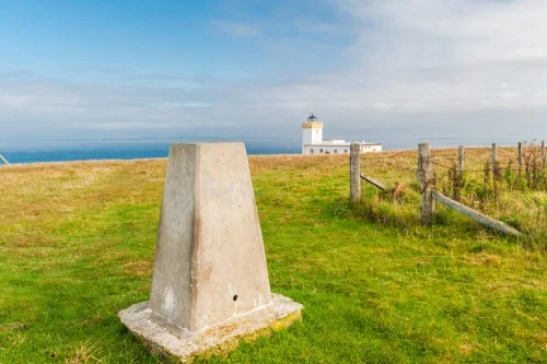 The OS trig point and lighthouse