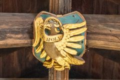 A painted and gilded roof boss