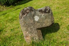 A worn medieval cross in the churchyard