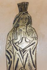 One of the medieval brasses on the south wall