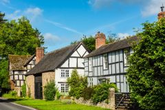 Timber-framed cottages north of the river Arrow