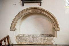 A medieval niche and empty stone coffin