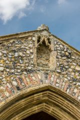 A statue niche over the porch