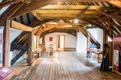 Under the timber-framed roof