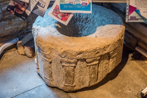 A medieval font bowl in the porch