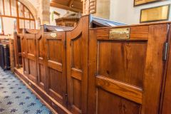 Box pews with name plates in the nave