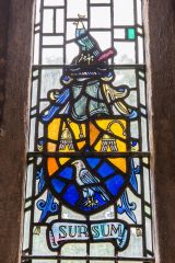 Heraldic stained glass in the chancel