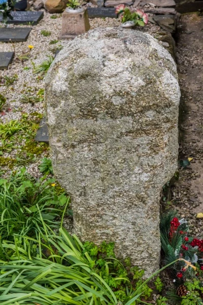 An ancient cross by the porch