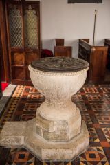 The simply carved Norman font