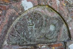 The north doorway tympanum of a serpent biting its tail