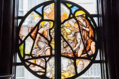 A roundel of Tudor and 17th century glass fragments